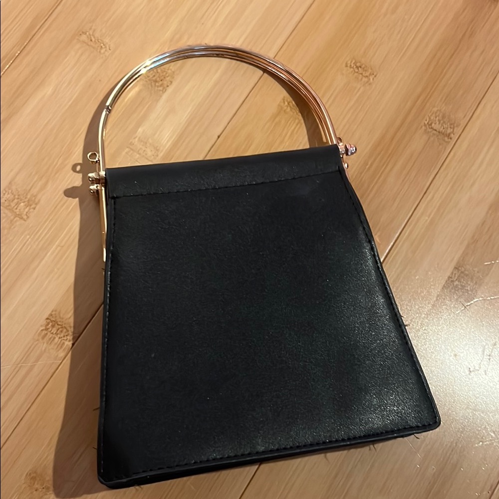 Elegant Black Handbag with Gold Handle